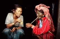 Elderly Chin women smoking tobacco together by Richard Diran